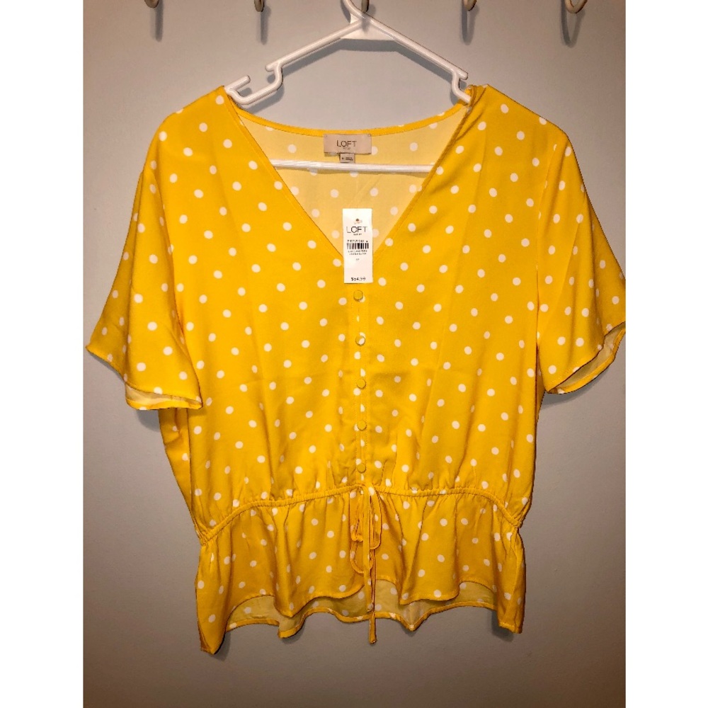 NWT. LOFT yellow polka dot peplum top with tie.